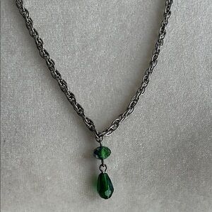 Silver toned rope chain with pretty green crystal bead pendant